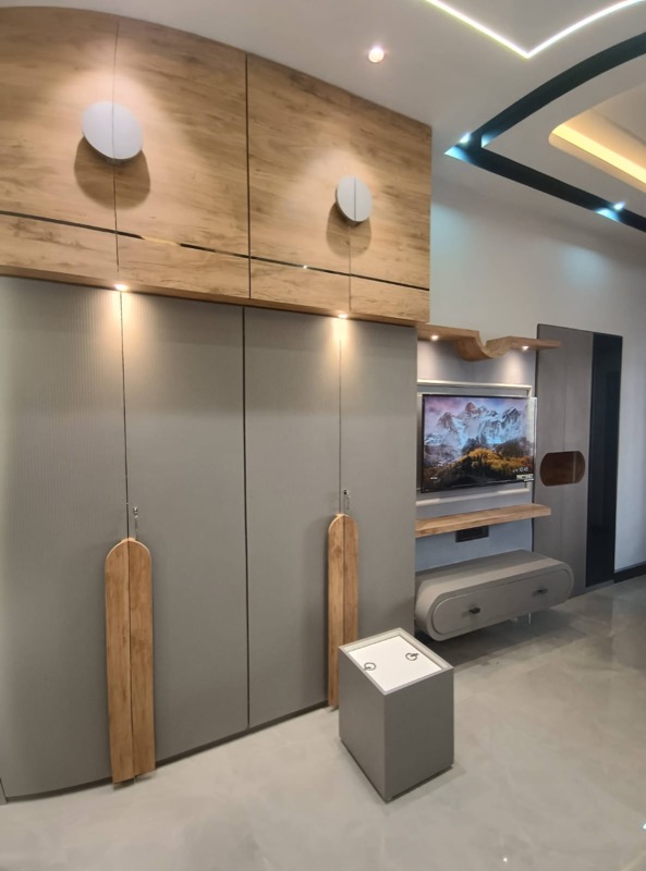 Bedroom media wall with wardrobe and TV unit
