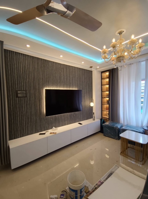 Living room TV wall with fluted panel and ceiling light