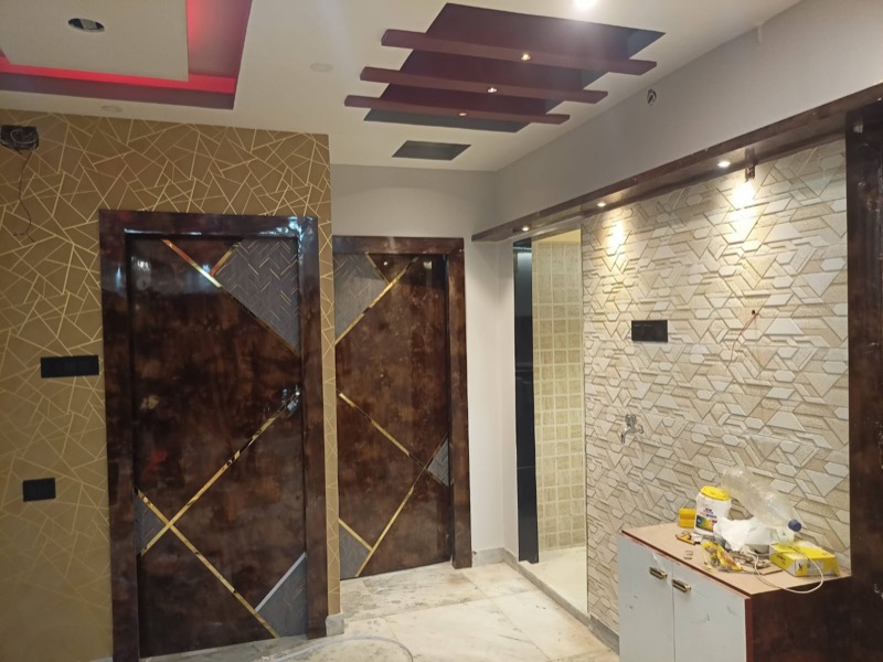 Entrance wall with textured finish and geometric door detail