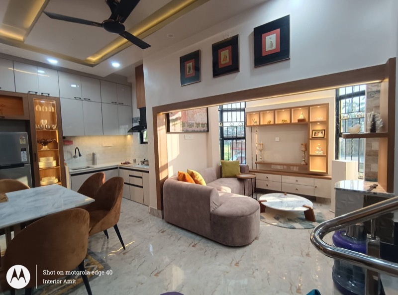 Open living room with sofa, display wall and dining connection