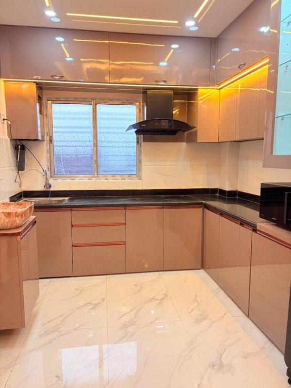 Modular utility kitchen with appliances and mint cabinetry