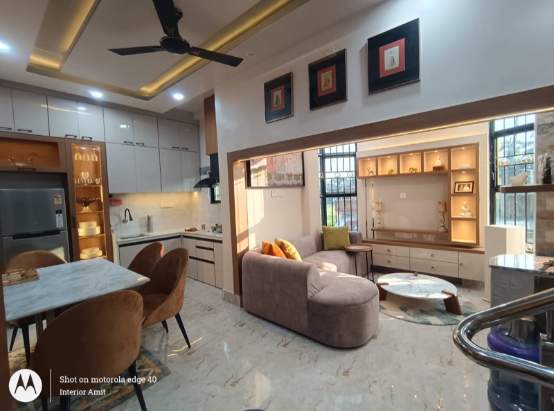 Completed living and dining interior with warm lighting